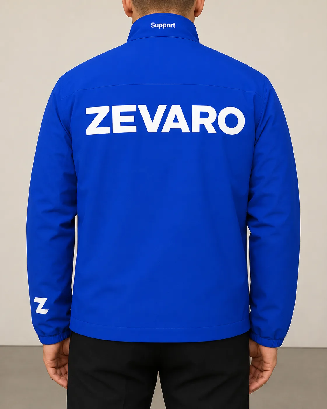 Worn rather than printed — the mark holds on fabric at body scale with nothing else on the garment.